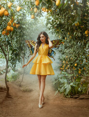 fairy tale girl walking in fabulous lemon garden. Fantasy woman in short yellow dress pixie...