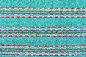 old turquoise towel with horizontal stripes ornament - flat background and texture