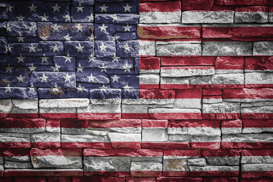 National flag of USA on stone  wall background.The concept of national pride and symbol of the country. Flag  banner on  stone texture background.
