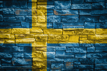 National flag of Sweden  on stone  wall background.The concept of national pride and symbol of the country. Flag  banner on  stone texture background.