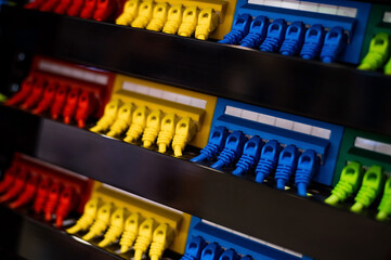 Multi-colored rows of network cables are connected to the system