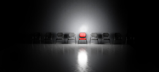 Red chair in spotlight. Job interview, recruitment concepts.