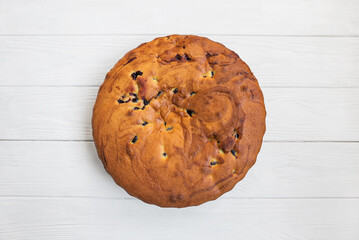 charlotte pie on a white wooden background.