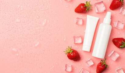 Top view photo of white cream tube and spray bottle without label strawberries ice cubes and drops...