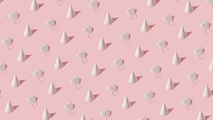 Creative pattern arrangement with white face mask and party hat on pastel pink background. Covid pandemic concept, modern minimalistic composition.