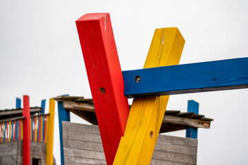 colorful wooden beams construction, children's playground