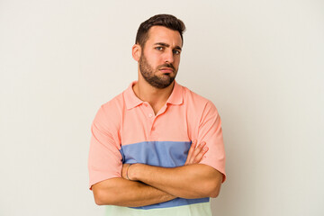 Young caucasian man isolated on white background who is bored, fatigued and need a relax day.