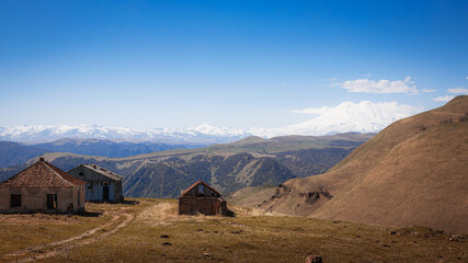 Elbrus And Green Hills with road At Sunny Summer Day. Dzhili-Su, Republic of Kabardino-Balkaria,North Caucasus, Russia.