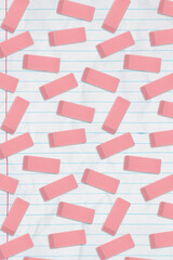 Pink eraser background on ruled paper