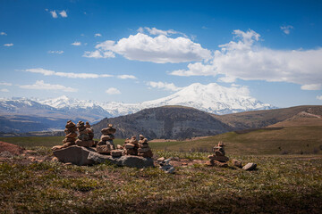 Elbrus And Green Hills with road At Sunny Summer Day. Dzhili-Su, Republic of Kabardino-Balkaria,North Caucasus, Russia.