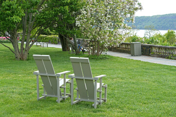 Great Lawn with chairs and magnificent views of Hudson River.  Wave Hill in Hudson Hill of...