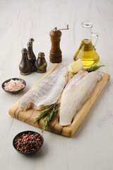 Raw zander fillet on wooden cutting board