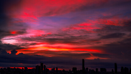 The high angle background of the city view with the secret light of the evening, blurring of night lights, showing the distribution of condominiums, dense homes in the capital community