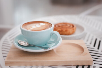 Hot coffee cup and fresh croissant