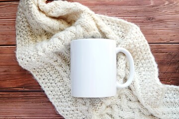 White coffee mug mockup, ceramic cup mockup, cozy winter composition on warm knitted scarf and wooden table background.