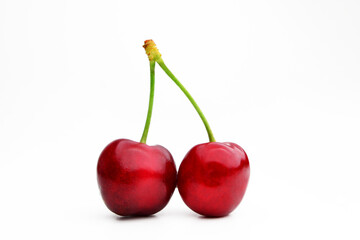 Cherry isolated. Cherry on white. Cherries. With clipping path. Red cherries on a white background full of vitamins and tasty flavor, sweet and ideal for eating raw or in desserts.