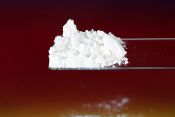 Flour with macro lens photographed against colorful gradient in studio