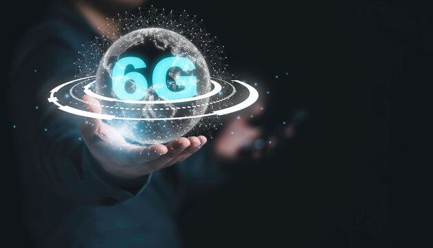 Businessman holding virtual world with 6G with connection line , Technology transformation concept.