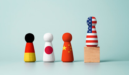 USA flag print screen on wooden figure standing on cube among China , Japan and Germany for highest...
