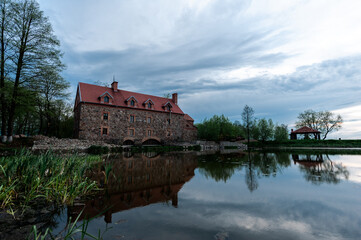 Fototapeta na wymiar Old stone mill of the 19th century in the village of Dvorishche