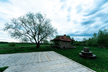 Antique gazebo with barbecue and wooden deck