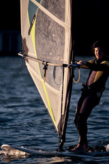 Windsurfer surfing on a windy day at the river.