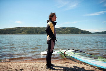 Windsurfer surfing on a windy summertime day at the river.