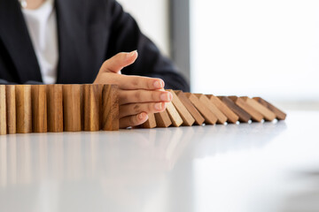 Abstract business women fail danger tower block game building construction protect plan and project control.strategy and successful intervention concept for business.