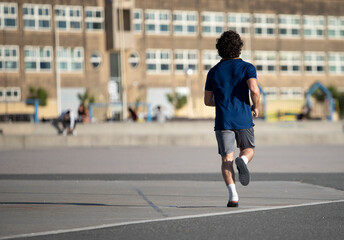 sportsman running on the street