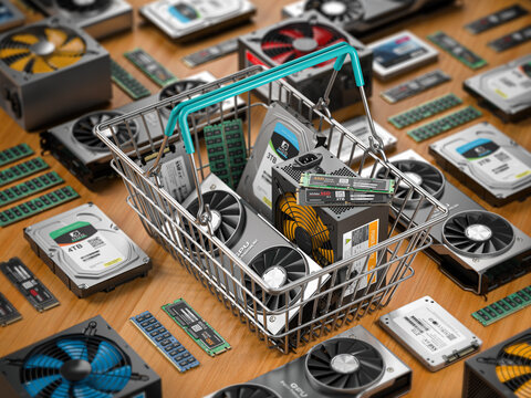 Computer hardware in shopping basket. Buying  pc computer parts online concept.