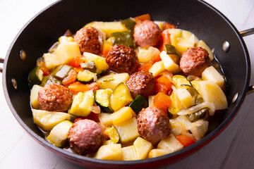 Meatballs with roasted vegetables. Traditional Spanish tapa.