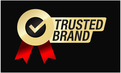 Obraz premium 'trusted brand'premium quality golden vector icon with tick mark and ribbons isolated on dark background