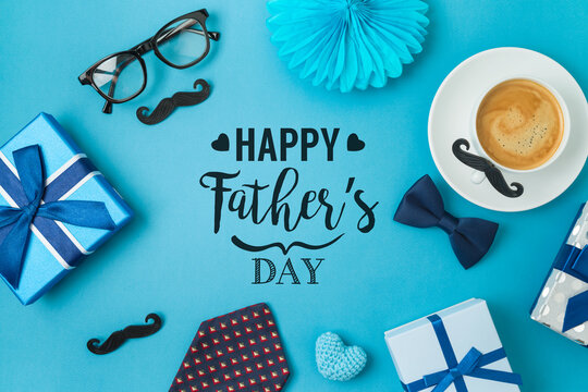 Happy Fathers day concept with coffee cup,  tie bow and gift box on blue background