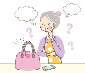 バッグの値段を考えているシニア女性