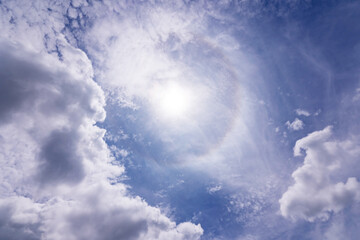 Sunny summer day background of blue sky with white clouds and sun in good weather day