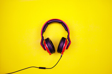 Top view of red headphone on light yellow paper background Flat Lay minimal Top down Flat lay...