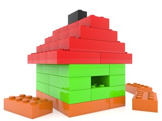 Playhouse from colored toy bricks on white