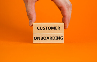 Customer onboarding success symbol. Wooden blocks with words 'Customer onboarding' on beautiful...