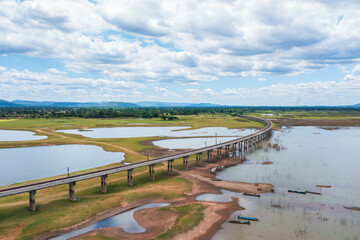 An aerial view of the railway bridge over a reservoir in Pasak Chonlasit Dam