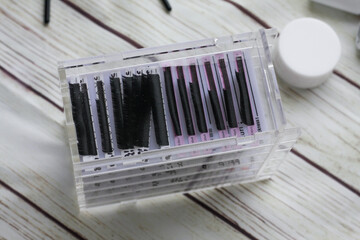 Lashmaker tools on white light background