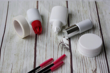 Lashmaker tools on white light background