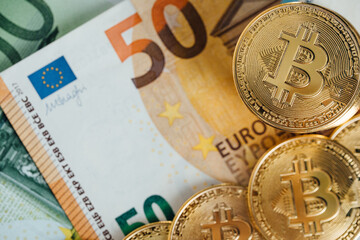 Euro Banknotes and Bitcoin cryptocurrency investing concept. Euro Money and Crypto currency golden bitcoin coin.