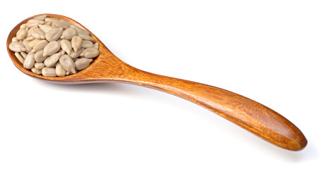 sunflower seeds in the wooden spoon, isolated on whtie background