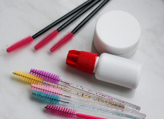 Lashmaker tools on white light background