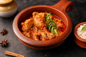 Spicy red Kerala chicken curry , rice Goan style chicken vindaloo. Butter chicken Murgh Makhani curry roast hot spicy gravy dish Dhaba Punjab, India. North Indian non-vegetarian cuisine Garam Masala. 