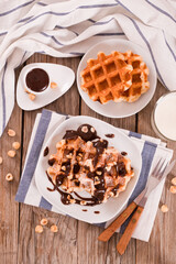 Waffles with chocolate cream and hazelnuts.