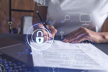 A businesswoman in casual wear signing the contract to prevent probability of risks in cyber...
