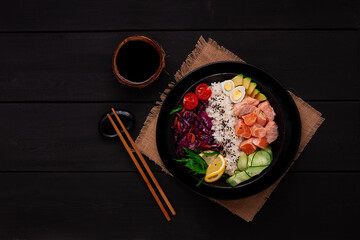 Poke bowl, salmon dish, rice, vegetables, quail eggs, avocado, lemon, healthy food, top view, horizontal, no people,