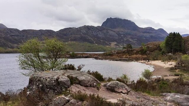 Clouds clipping the peak of Mount Siloch close to Loch Maree in the Scottish Highlands.