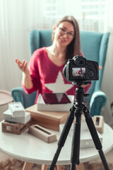 woman blogger makes video of unpacking gadgets at home